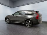 the rear end of a dark colored volvo suv parked in a garage