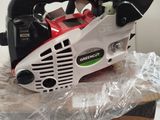 a chainsaw sitting on top of a box on a table
