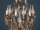 a crystal chandelier hanging from the ceiling in a room