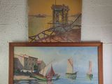 two paintings hanging on the wall above a bed