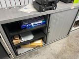 a metal cabinet with a bunch of items on top of it