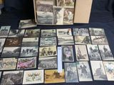 a lot of old postcards sitting on a table