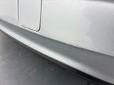 a close up of a car door handle with a sticker on it