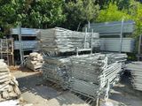 a lot of metal pipes stacked on top of each other