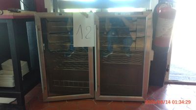two wine coolers that are on display in a store