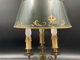 an image of a table lamp with a green shade on it