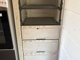 an old white refrigerator sitting in a kitchen next to a refrigerator freezer