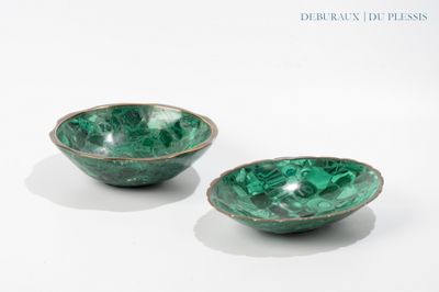 pair of green marbled bowls on a white surface