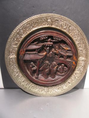a plate with a picture of a man and a woman on it
