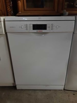a white dishwasher and a white dishwasher in a kitchen