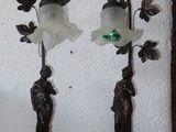 two lamps that are sitting on a table next to each other