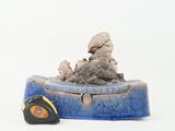 a small toy car that is sitting on top of a box