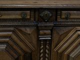 a close up of a wooden cabinet with a clock on it