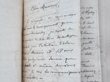 a close up of a book with writing on it sitting on top of a table