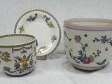 two cups and a saucer sitting on a table