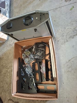a box with a gun inside of it on the floor