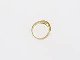 an image of a gold ring on a white surface