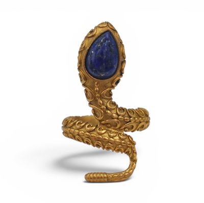 a close up of a gold ring with a blue stone in the middle
