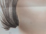 a picture of a woman ' s face with long hair