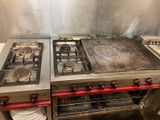 two burners on the stove in the kitchen