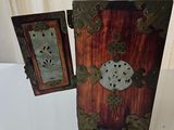 a small wooden box with a clock inside of it