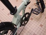 a close up of a bicycle on a tiled floor