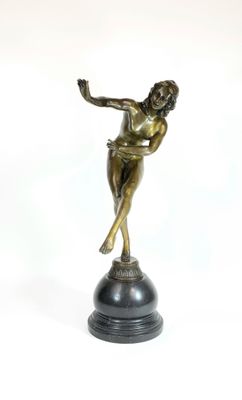 bronze statue of a woman on a pedestal with her arms outstretched