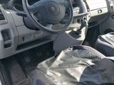 a car with a steering wheel and a bag in the passenger seat