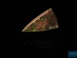 a close up of a piece of metal with green lights on it