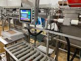 a picture of a machine that is working on a conveyor belt