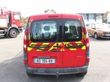 a red van that has a yellow and red decal on it