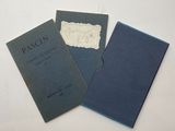 three books sitting on top of a white table next to each other
