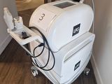 a white machine that is sitting in the corner of a room