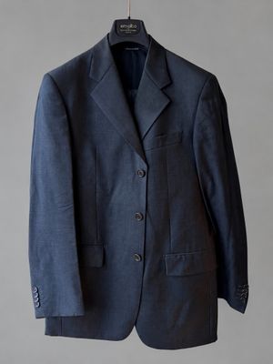 an image of a suit hanging on a hanger