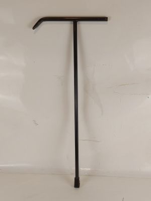 a close up of a black metal handle on a white wall