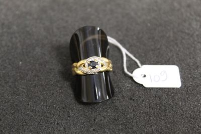 a close up of a ring on a black surface with a price tag