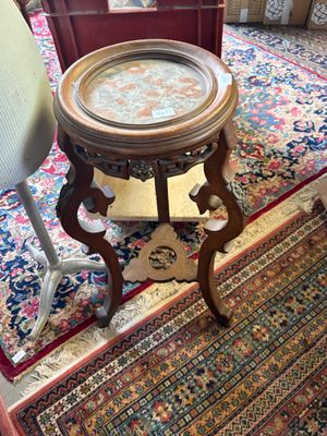 a small table that has a glass top on it