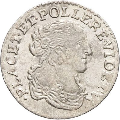 a silver coin with a woman ' s head on it