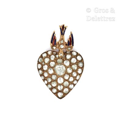 a close up of a heart shaped brooch with a crown on top of it