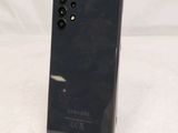 the back of a black samsung galaxy note 10 lite on a white surface