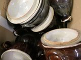 a box full of dishes and cups in it