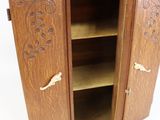a wooden cabinet with a door and shelves on it