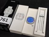 a box with a watch inside of it and a box with a watch inside of it