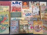 many children ' s books on display on a table