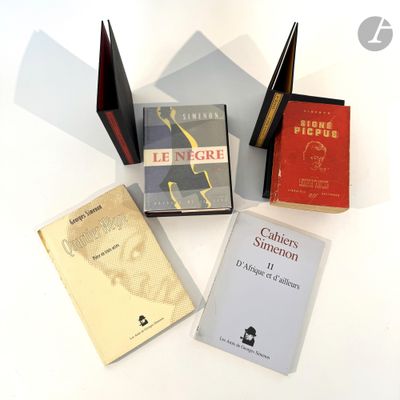 three books that are sitting next to each other on a table