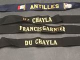 three lanyards with name tags on them sitting on a table