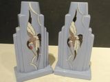 pair of blue art deco bookends with cranes on them