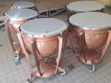 three different types of musical instruments sitting on the floor