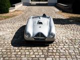 a silver car that is parked in front of a house