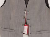 the vest is made of grey wool and has a black leather collar